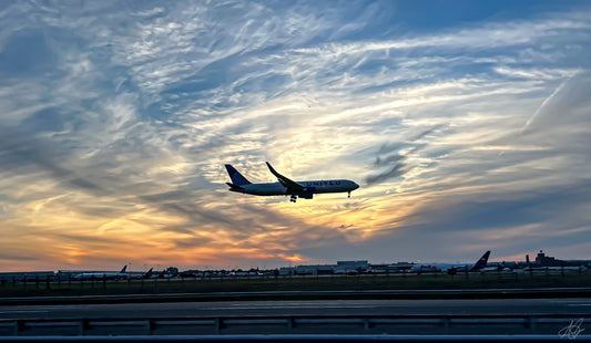 Airplane Landing during the Sunset