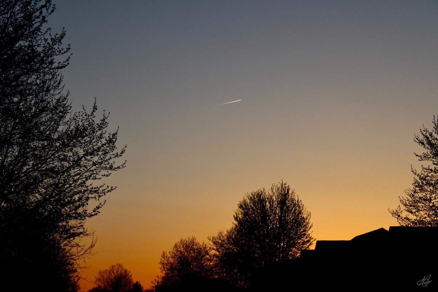 Beautiful Sunset with a Jet in the Far Distance