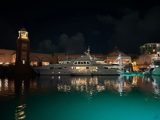 Atlantis Marina Village at Night with a Huge Yacht