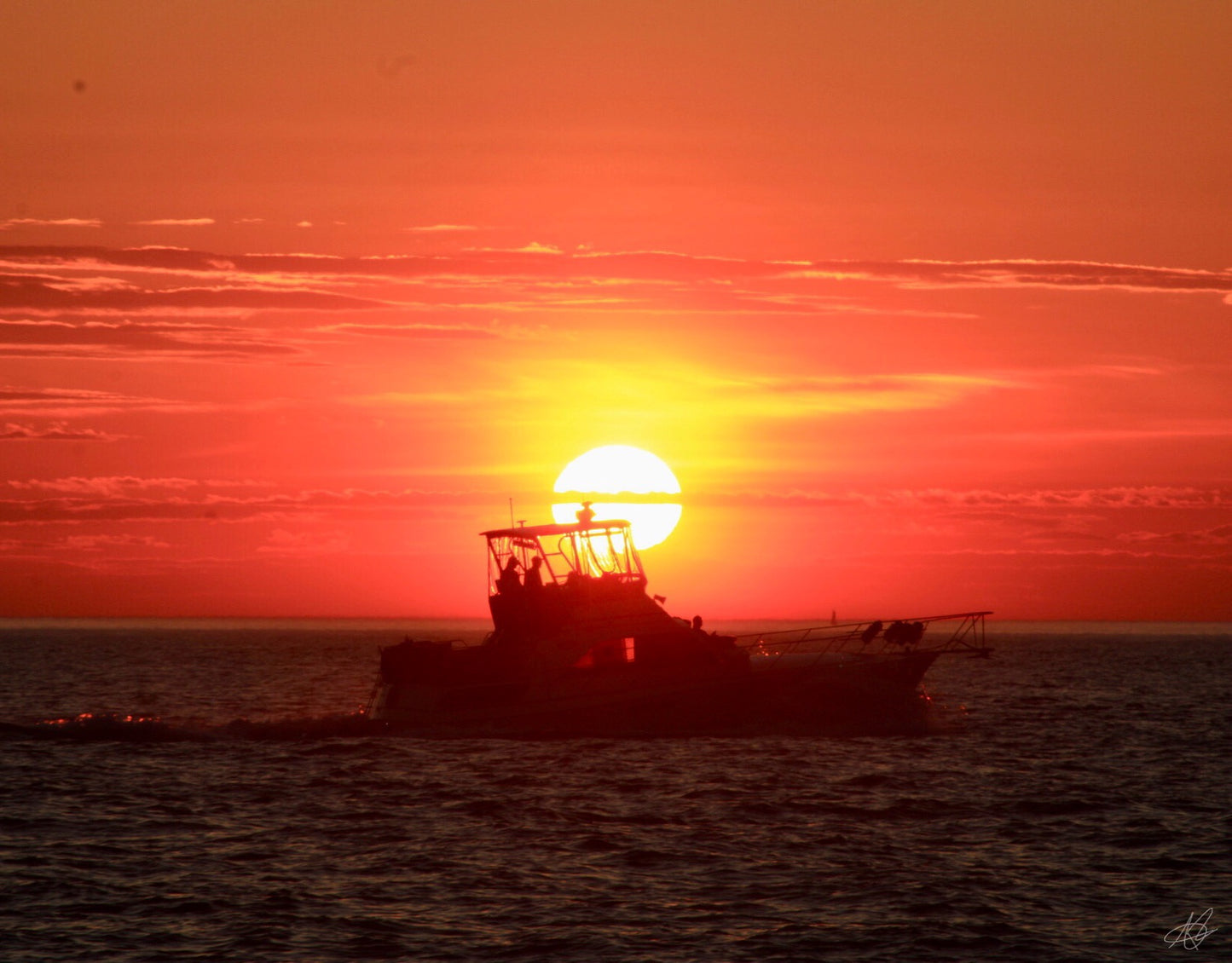 Beautiful Sunset with a Boat on the Water