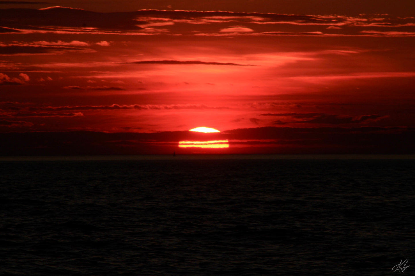 Beautiful Glowing Sunset Over Ocean Setting Slowly