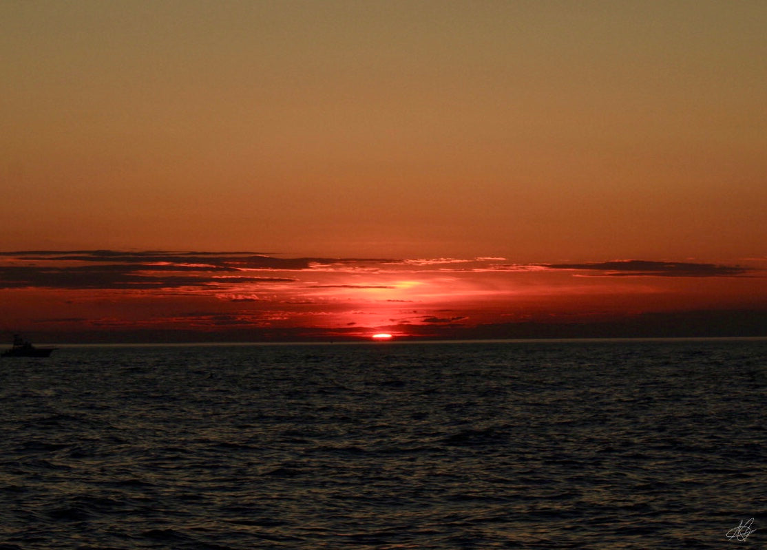 Beautiful Glowing Sunset Over Ocean Zoomed Out