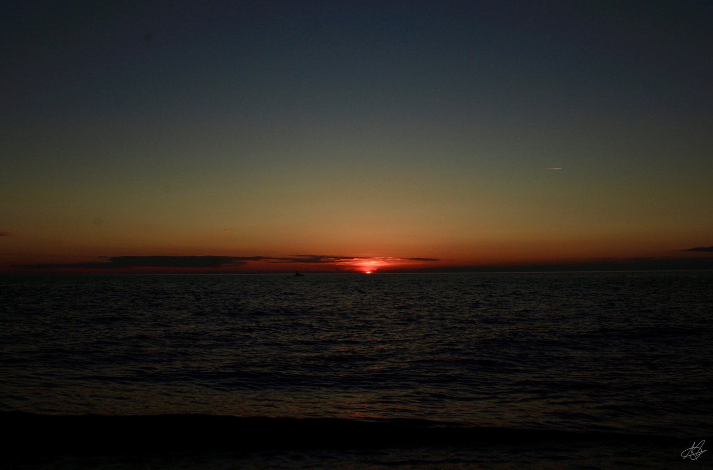 Beautiful Glowing Sunset Over Ocean at 0.5x Zoom