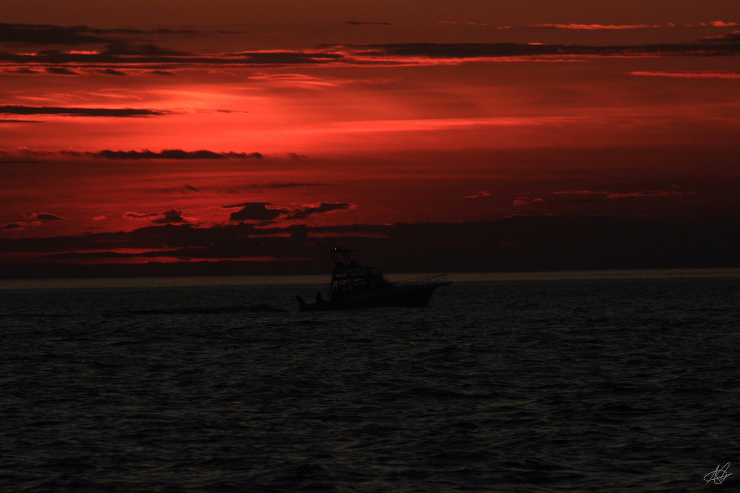 Blue Hour of Red Glowing Sunset Over Ocean
