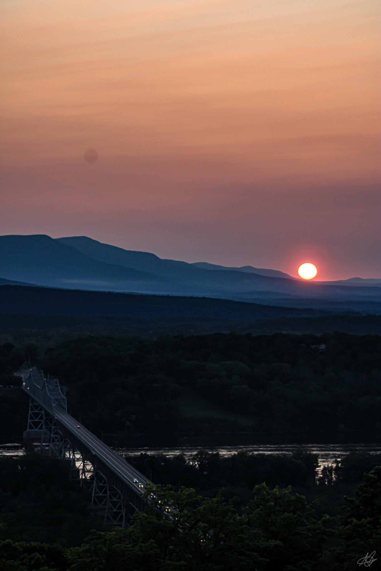 Sunset Over a Mountain with a Highway Bridge